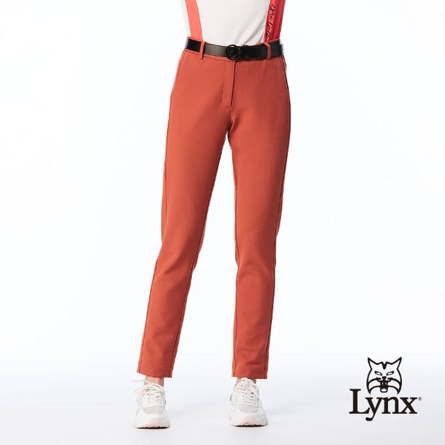 【Lynx Golf】女款日本進口布料彈性舒適素面邊剪裁造型窄管長褲(橘色)